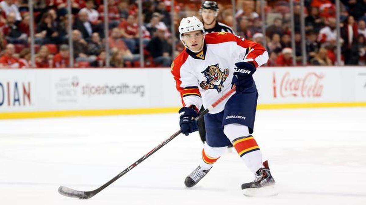
Florida Panthers defenseman Aaron Ekblad (5) passes against the Detroit Red Wings in the first period of an NHL hockey game in Detroit Friday, Dec. 12, 2014.
