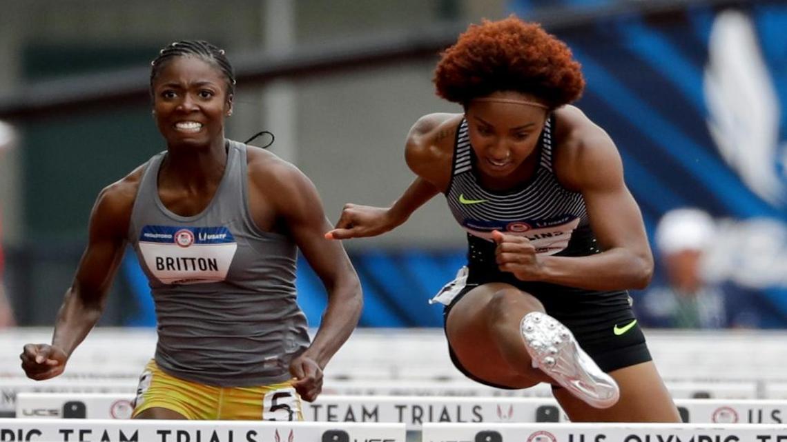 Brianna Rollins, right, wins her heat ahead of Evonne Britton during qualifying for women's 100-meter hurdles at the U.S. Olympic Track and Field Trials, Thurs., July 7, 2016, in Eugene Ore.