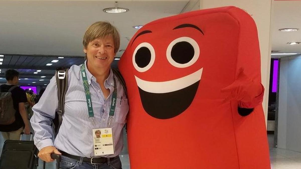 Dave Barry poses with a big SIM card.