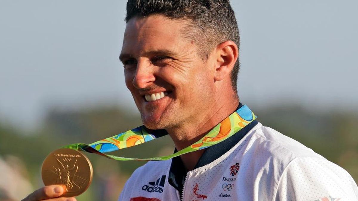 Justin Rose of Great Britain, holds up the gold medal after during the final round of the men's golf event at the 2016 Summer Olympics in Rio de Janeiro, Brazil, Sunday, Aug. 14, 2016.