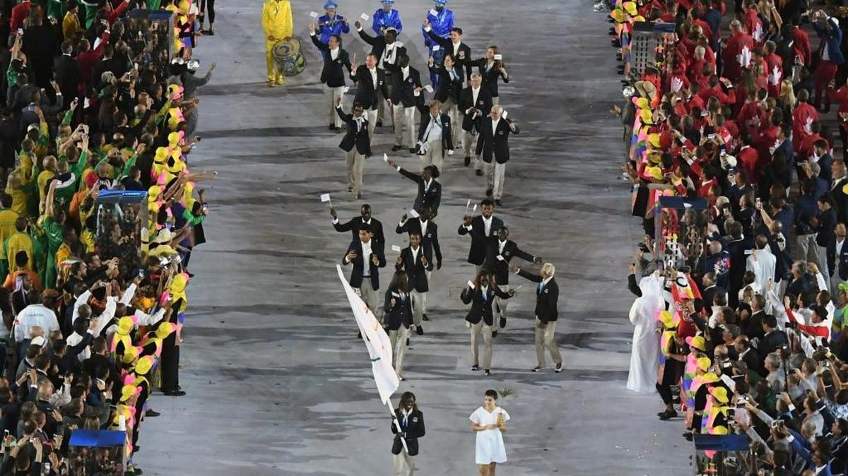 Rose Lokonyen Nathike carries the flag of Refugee Olympic Team during the opening ceremony for the 2016 Summer Olympics in Rio de Janeiro, Brazil, Friday, Aug. 5, 2016.