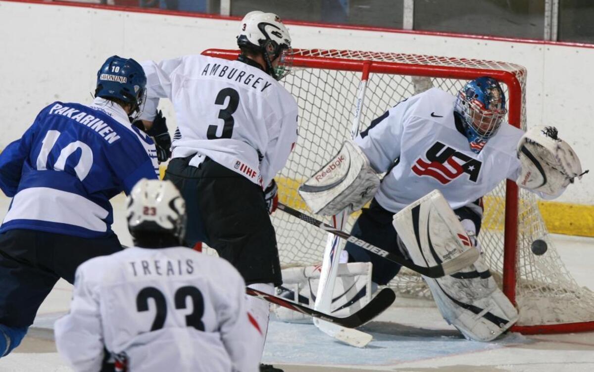 United States’ goalie Brandon Maxwell catches the puck as Tyler Amburgey (3) moves in to defend against Finland’s Joonas Hurri (3) while United States’ A.J. Treais (23) watches the play during the under 18 men’s Four Nations Cup Hockey Tournament Championship game in Lake Placid, N.Y. USA Hockey named David Leggio and Brandon Maxwell as the final two goaltenders for its Olympic team. U.S. general manager Jim Johannson on Thursday, Jan. 11, 2018, announced the final two players on the 25-man roster.