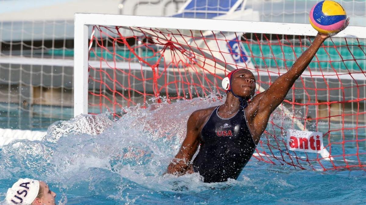Goalie Ashleigh Johnson of the U.S. women's water polo team, blocks a shot as they play Hungry in a practice match at Ransom Everglades school in Miami, Florida, June 27, 2016. Johnson attended Ransom Everglades where she played the game.