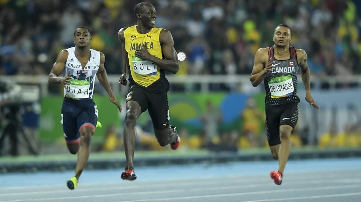 Jamaican sprinter Usain Bolt became the first person to win three straight Olympic 100-meter titles Sunday night. American Justin Gatlin, Bolt’s closest pursuer over the past four years, finished second. Andre de Grasse of Canada won the bronze.