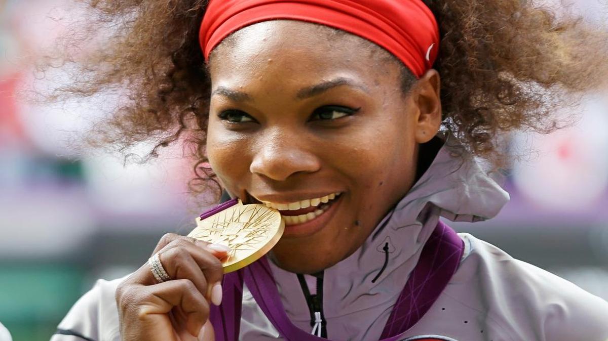 Serena Williams poses with the gold medal she won for women’s singles at the 2012 Summer Games in London.
