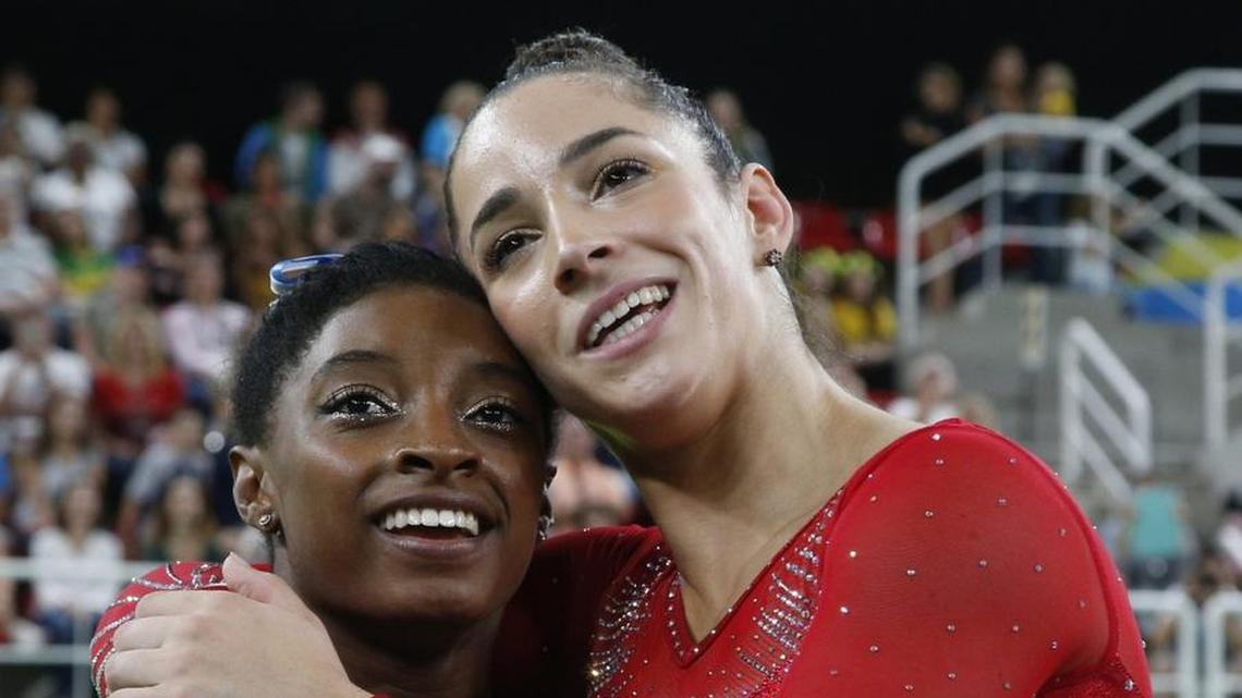 Aly Raisman, right, embraces Simone Biles after the U.S. teammates won silver and gold, respectively, in the women’s all-around at the 2016 Summer Olympics.