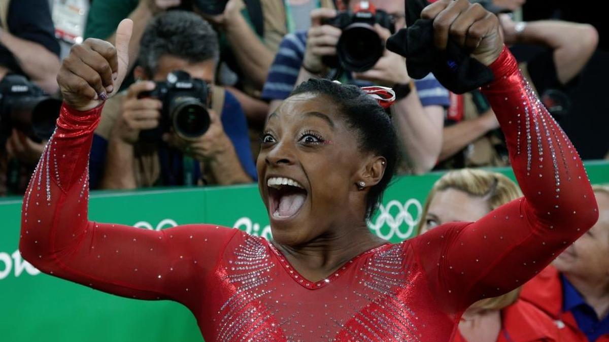 United States' Simone Biles celebrates after her winning gold in the vault during the artistic gymnastics women's apparatus final at the 2016 Summer Olympics in Rio de Janeiro, Brazil, Sunday, Aug. 14, 2016.