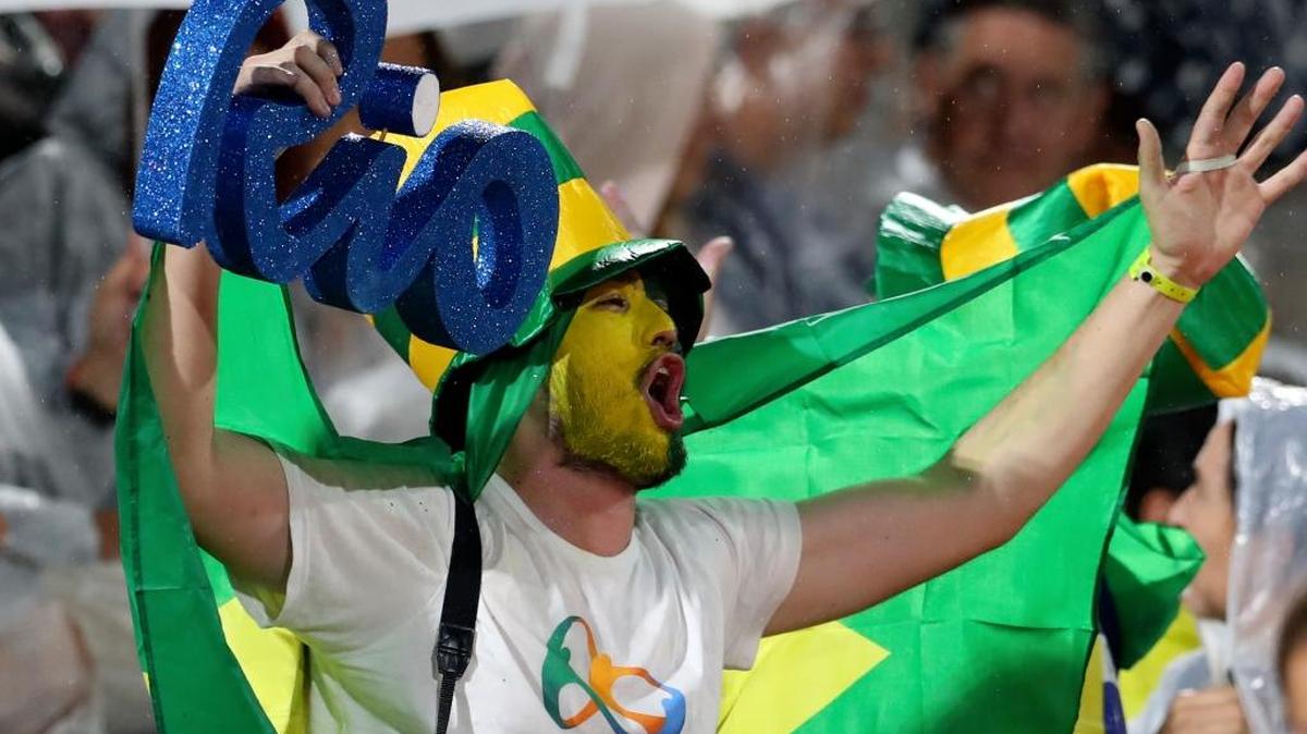 Fans await the start of the men’s beach volleyball gold medal match between Brazil and Italy at the Summer Olympics in Rio de Janeiro on Thursday, Aug. 18, 2016.