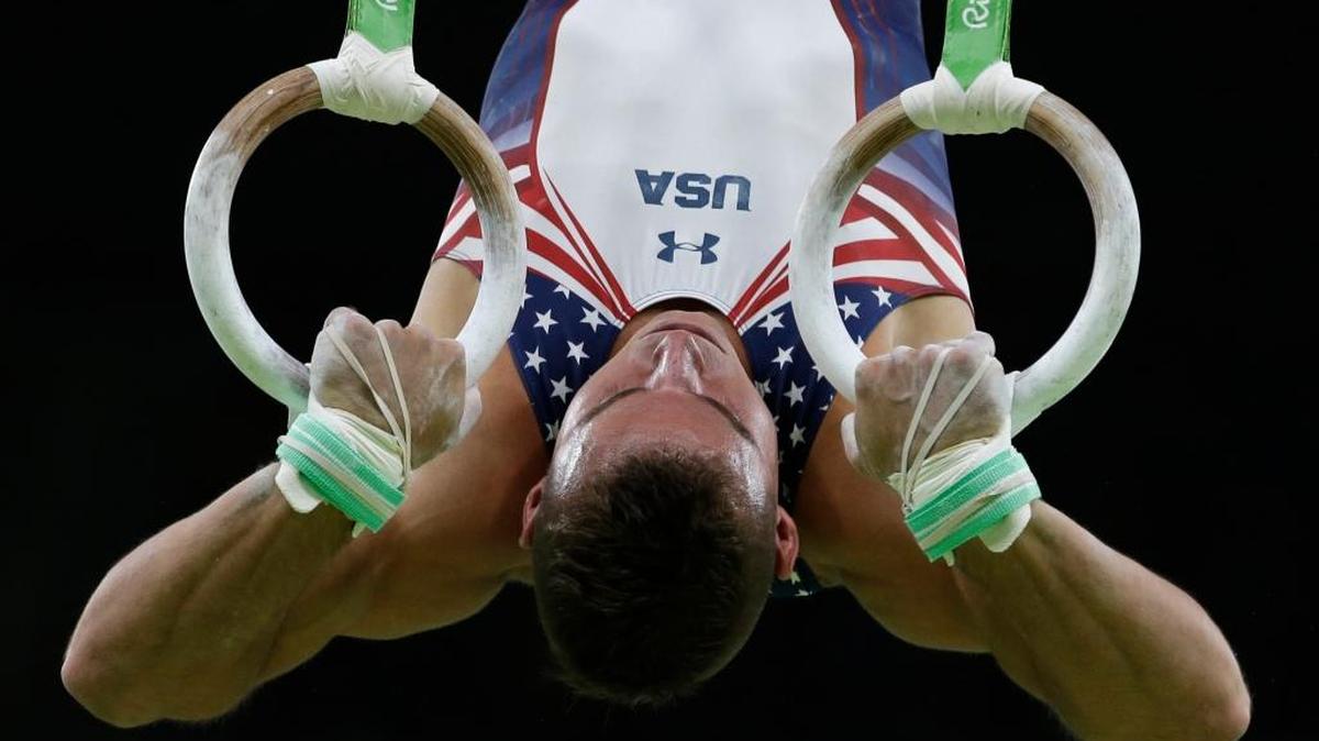 Sam Mikulak of the United States performs on the rings during the artistic gymnastics men’s qualification competition at the 2016 Olympics in Rio de Janeiro on Saturday. Homestead’s Danell Leyva performed well on high bar and parallel bars.