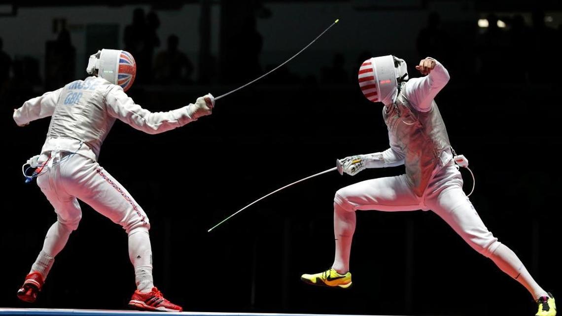 Alexander Massialas from United States, right, and Richard Kruse from Great Britain compete during the semifinal men's individual foil fencing event at the 2016 Summer Olympics in Rio de Janeiro, Brazil, on Sunday.