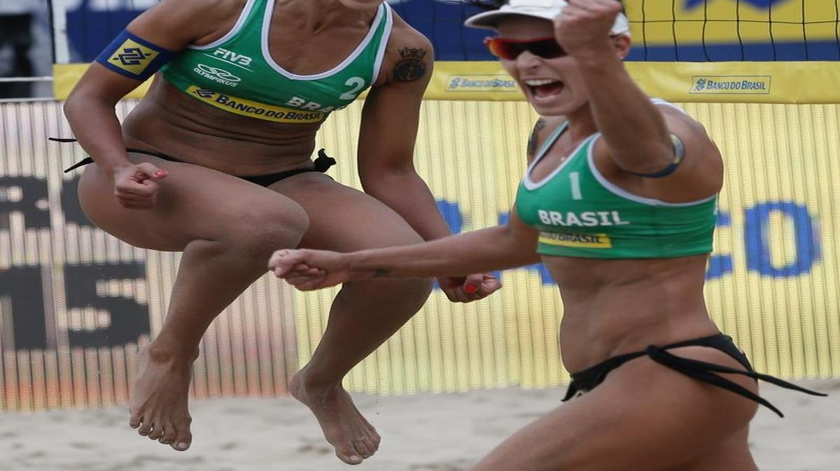 
Gold-medal winners Brazil's Barbara, left, and Agatha celebrate after winning a point in the FIVB Beach Volleyball World Tour Championship Rio Open 2015 at Copacabana Beach, in Rio de Janeiro, Brazil, Sunday, Sept. 6, 2015. 
