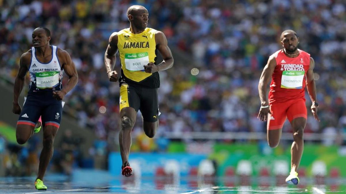 Jamaica’s Usain Bolt, center, won his 100-meter heat in 10.07 and is looking for three gold medals in a row.