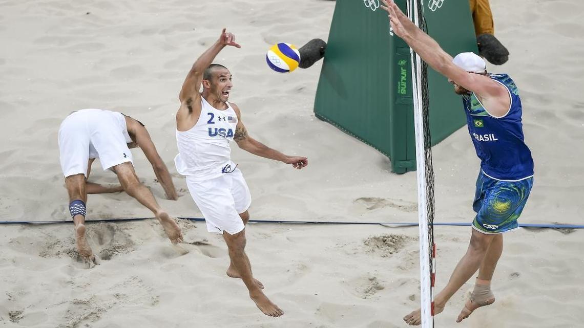 United States beach volleyball player Nicholas Lucena scored a point on a return over Brazil's Alison Cerutti, right, on Monday in the quarterfinal loss to Brazil at the Olympic Stadium during the 2016 Summer Olympics Games in Rio de Janeiro, Brazil. Lucena and his partner Phil Dalhausser lost two sets to one to end their Olympic tournament.