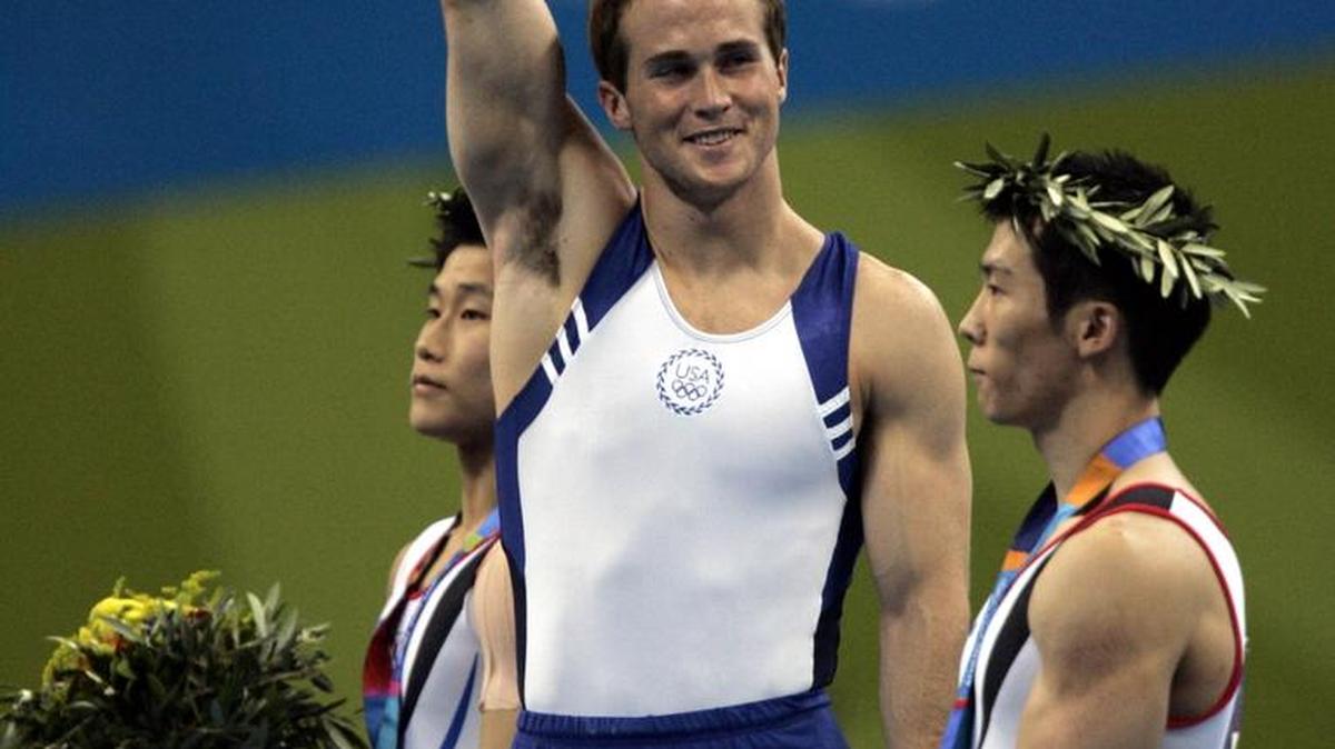 Paul Hamm reacts after winning the gold medal on Aug. 18, 2004, three days before the revelation that bronze medalist Yang Tae-young likely should have won gold.