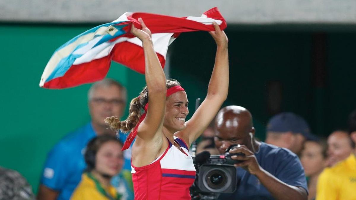 Miami resident Monica Puig won the women’s tennis singles gold medal as a member of the team from Puerto Rico, the first medal of any kind for the island.