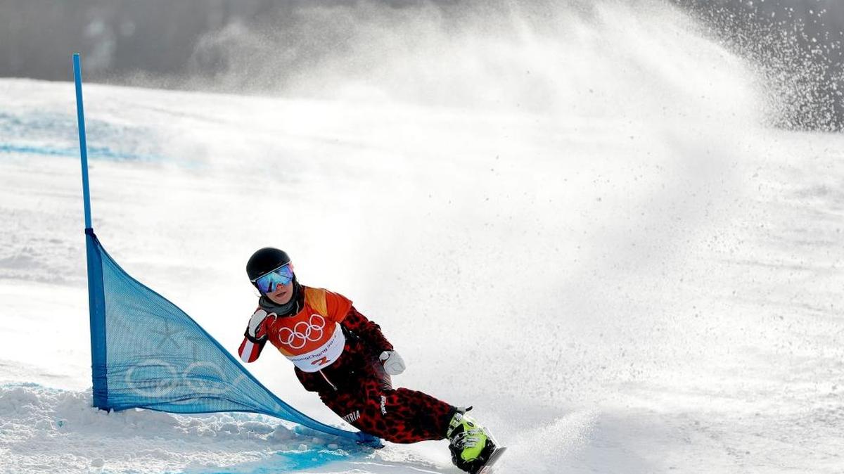 Daniela Ulbing of Austria runs the course during the women’s parallel giant slalom quarterfinals at Phoenix Snow Park at the 2018 Winter Olympics in Pyeongchang, South Korea, Saturday, Feb. 24, 2018. The squirrel that got into her path is not seen in this photo.