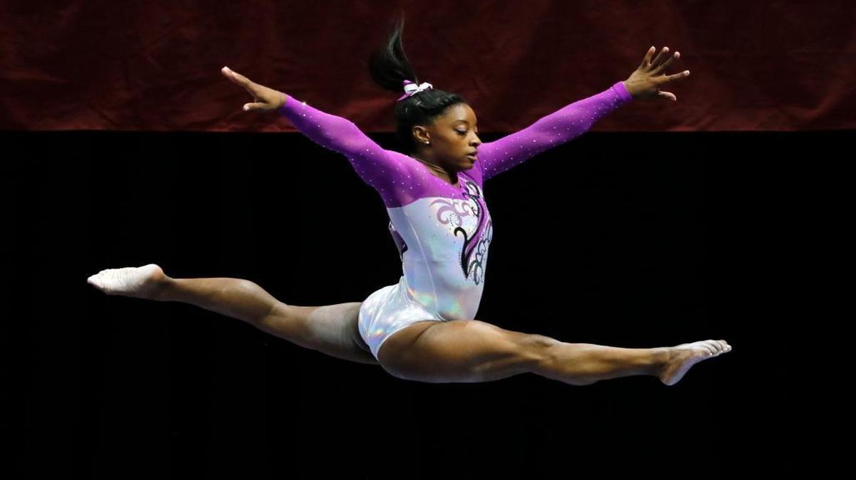 Simone Biles was born to drug-addicted parents, placed into foster care at age 2 and was adopted by her grandfather and his second wife. ‘My journey has been a blessing,’ she said.
