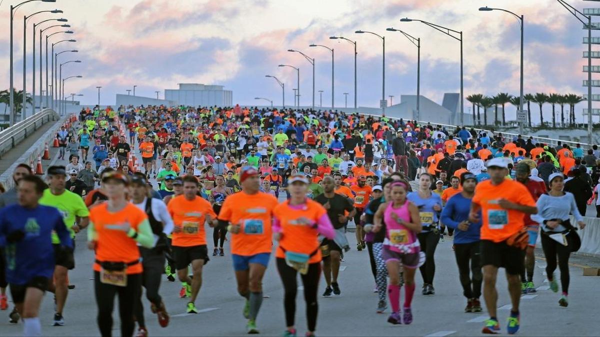 Runners travel on the MacArthur Causeway during the Miami Marathon and Half Marathon on Sunday, Jan. 24, 2016.