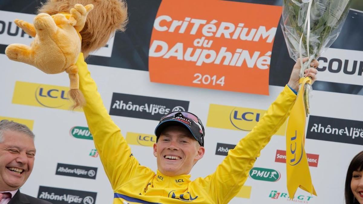 
In this June 15, 2014, file photo, Andrew Talansky, of the United States, celebrates on the podium after winning the 66th Dauphine cycling race, in Courchevel, France. There will only be three Americans on the start line for the Tour de France on Saturday, July 4, 2015, the fewest in nearly two decades. Tejay Van Garderen, Andrew Talansky and Tyler Farrar.
