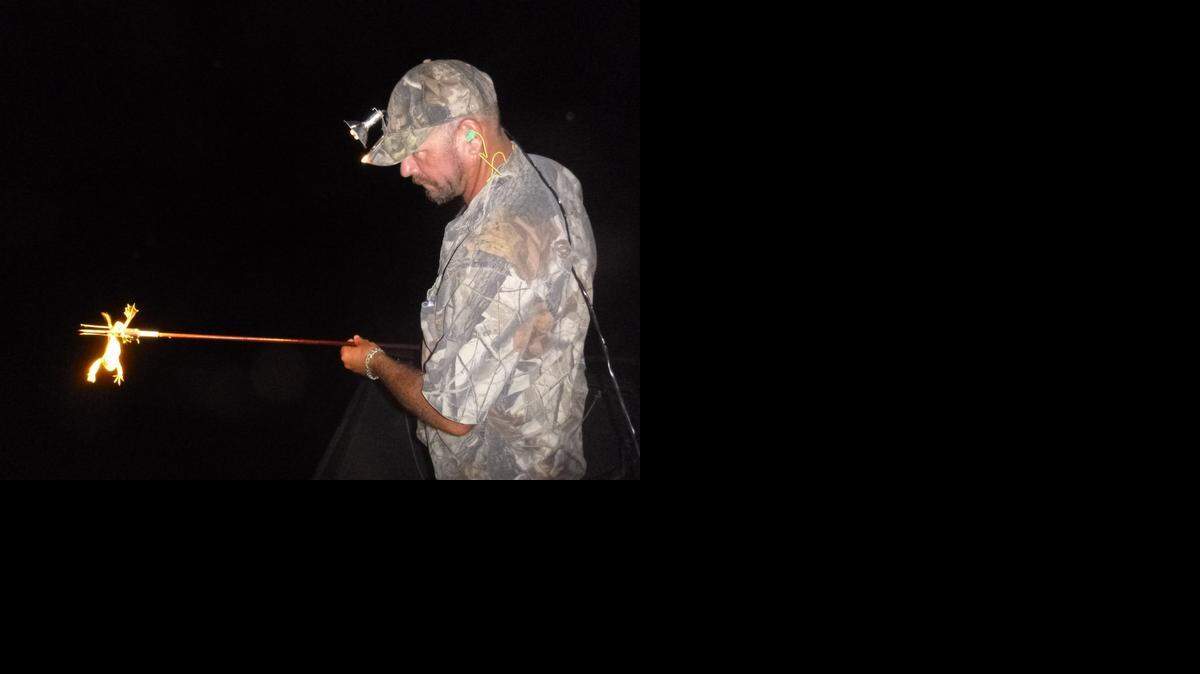 <cutline_leadin>Snack attack:</cutline_leadin> Captain Jason Peters of JP Outfitters gigs a frog in the Everglades near Sawgrass Recreation Park.