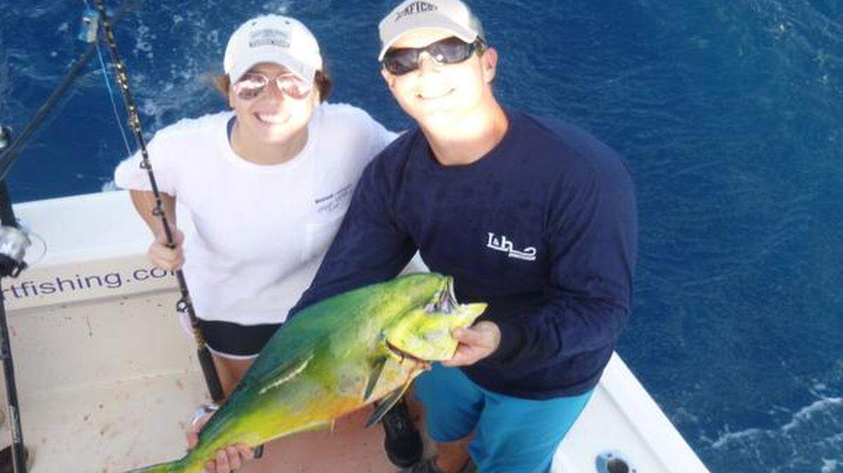 
Annie Holcombe, left, and crew member Sherman Huffman hold up one of many mahis Holcombe caught Oct. 10 on Key Biscayne-based charterboat L & H.
