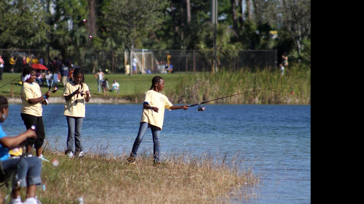
Members of Girl Scout Troop 676 cast their lines to catch a fish during the Captain Bob Lewis Kids Fishing Challenge at Tropical Park in 2012. The first 300 kids received a free rod, bait and tackle to use during the day.
