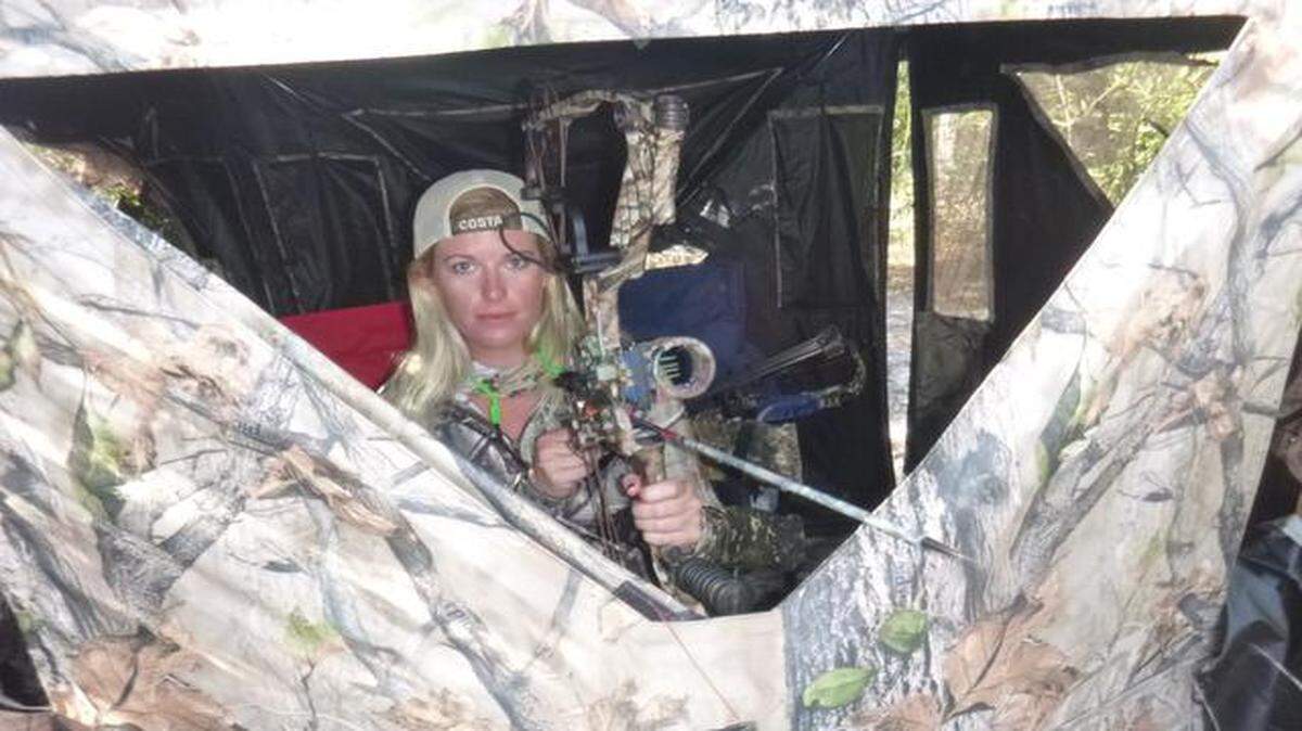 <cutline_leadin>At home:</cutline_leadin> Bow hunter Lacey Kelly sits in a ground blind at a private hunting lodge near Chiefland.