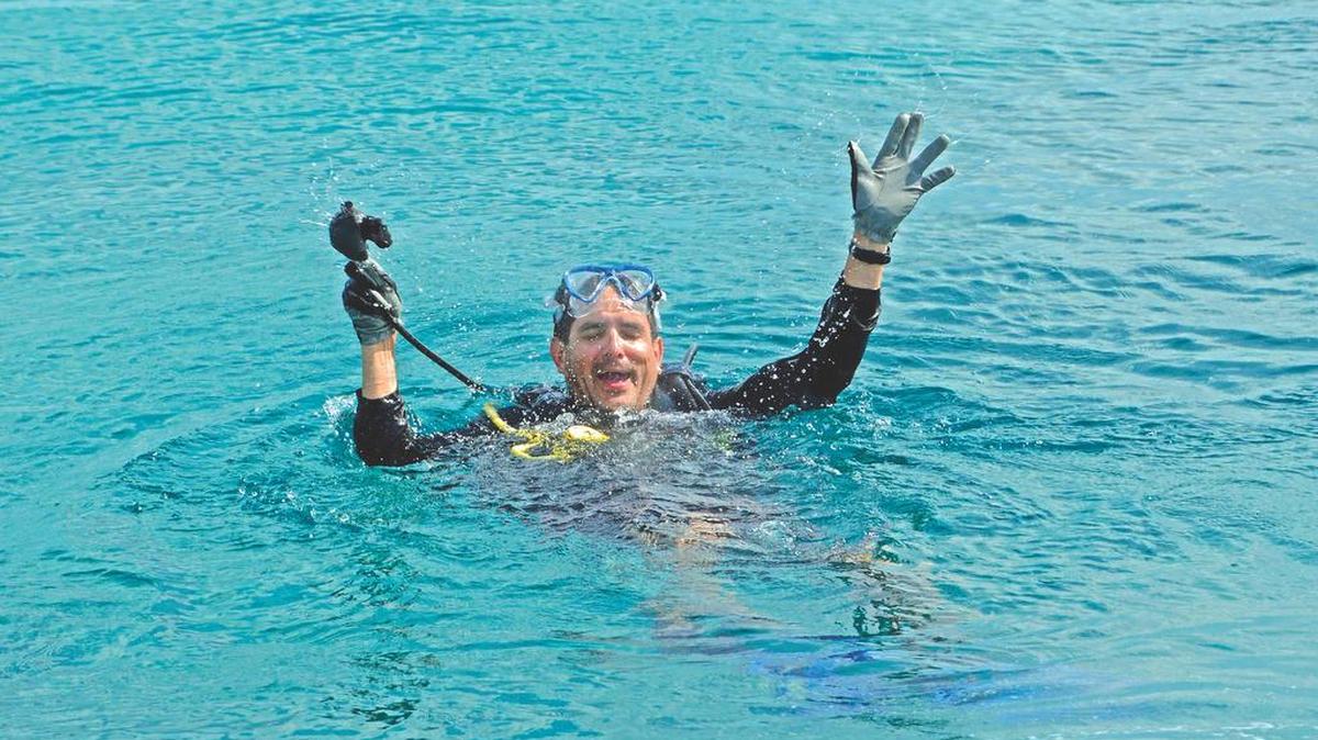 
Ken Avalos, from Tampa, acts like a diver panicking during a recent rescue diving exercise.
