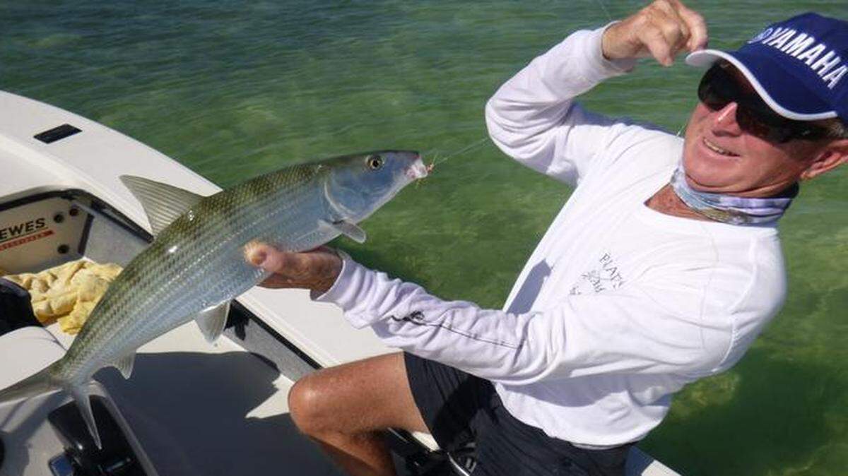 
Captain Tim Carlile holds a bonefish estimated at 5 pounds caught by Sue Cocking on the oceanside flats of the Lower Keys.

