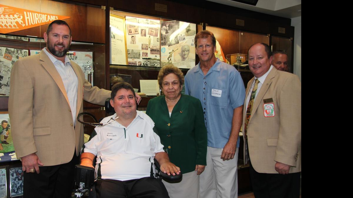 
The Miami Sports Hall of Fame Celebrity Dolphin Tournament raises funds for organizations such as The Miami Project. Marc Buoniconti, second from left, attended a check presentation with ex-UM president Donna Shalala, center, after the 2013 event.
