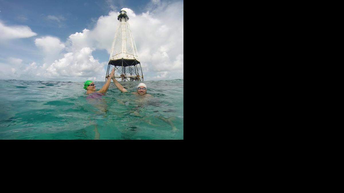 
Jackie Brown, left, and Chris Blythe participated in the Swim for Alligator Light challenge as a two-person relay team last year, but this time, each is doing it solo.
