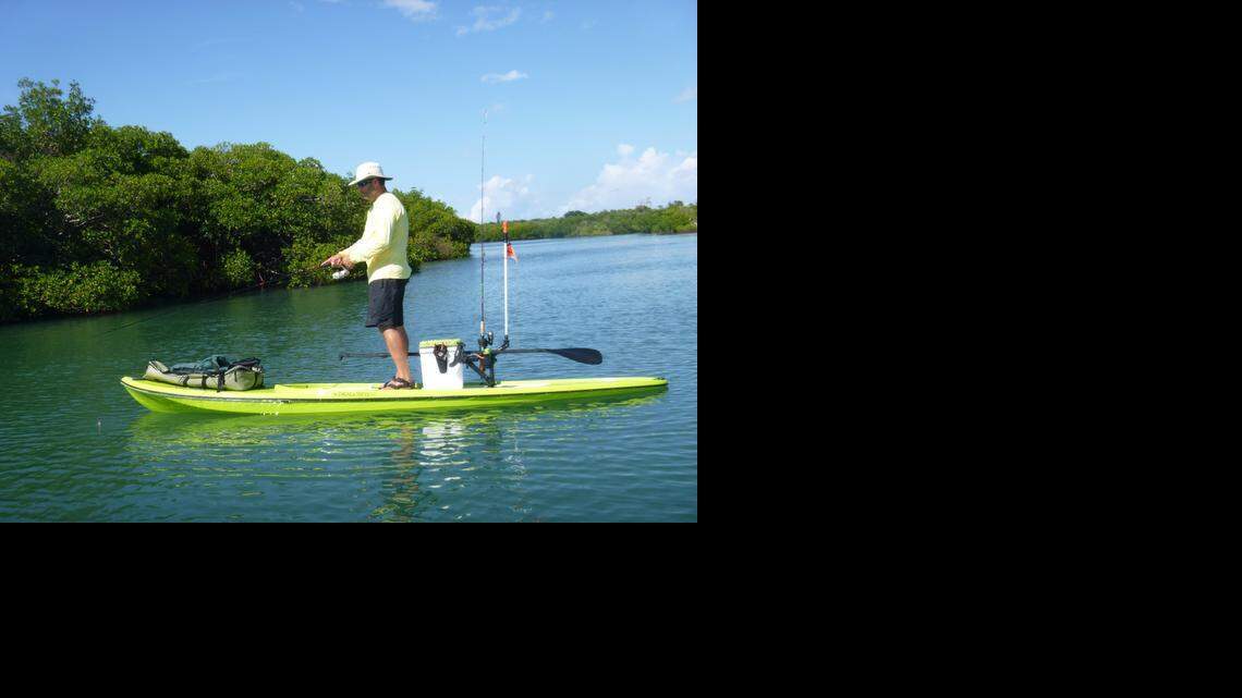 
Peter Hinck fishes from his stand-up paddleboard at North Hutchinson Island near Fort Pierce.

