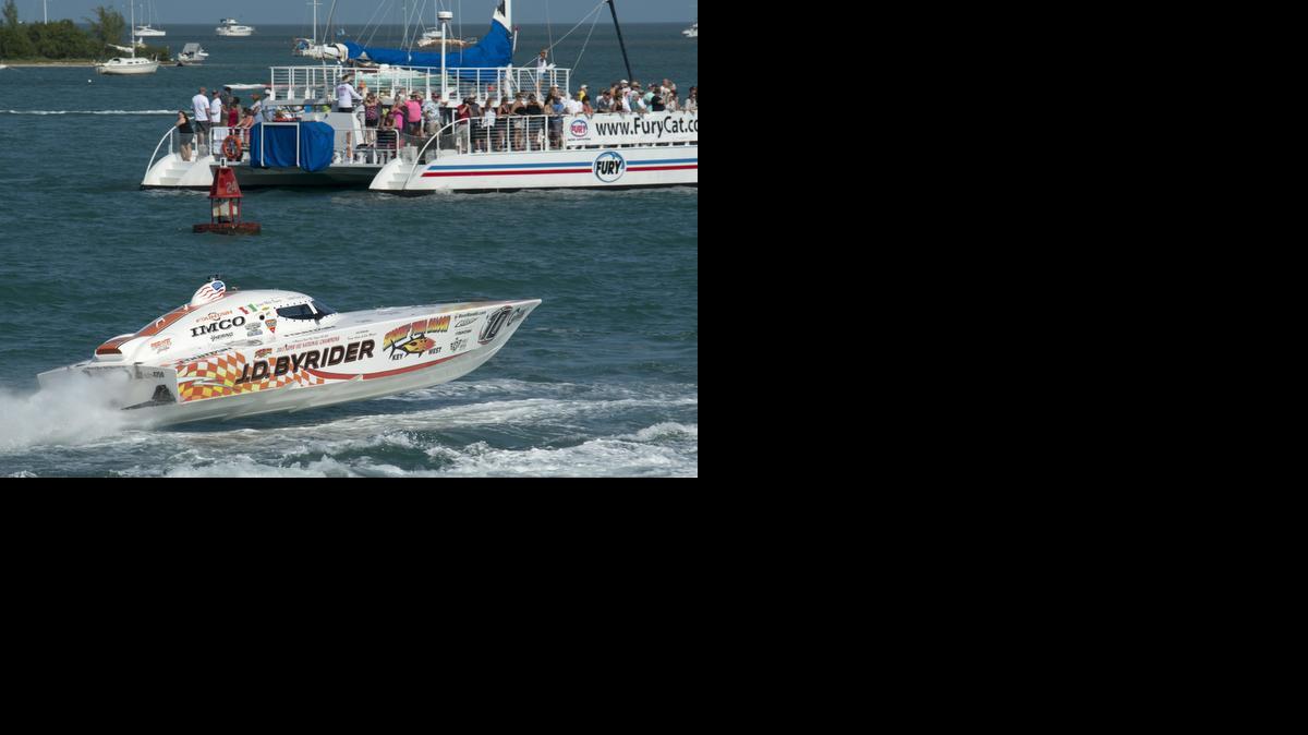 
J.D. Byrider, piloted by Mike Figuero of Satellite Beach and Frank Sarro of Palm Bay, speeds by spectators during the first of three race days at the Key West World Championship on Wednesday. Shortly afterward, Byrider rolled over and both men had to be rescued. 
