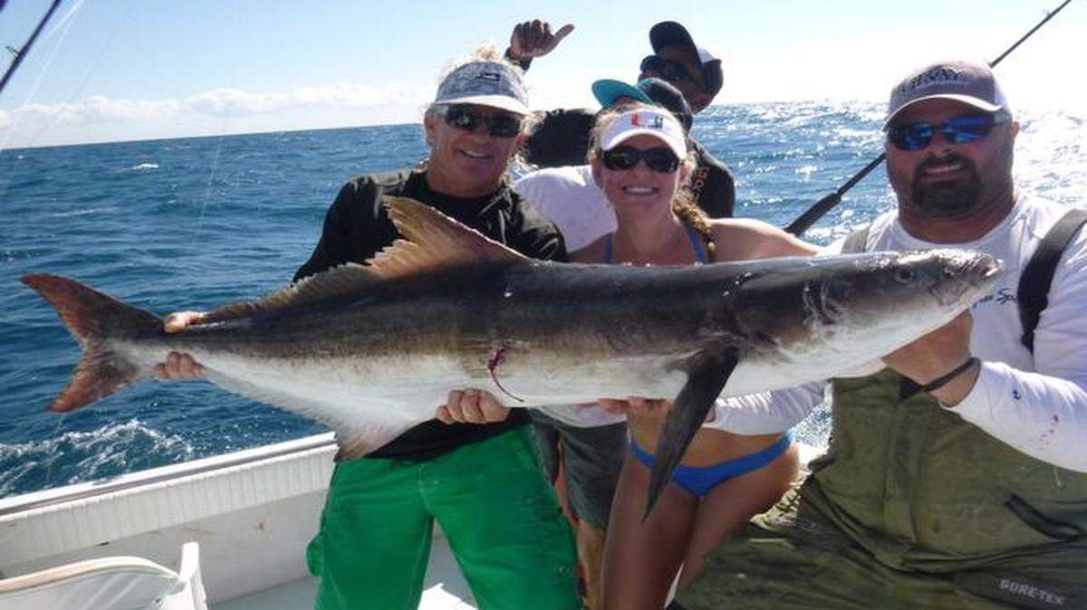 <cutline_leadin>Winning crew:</cutline_leadin> The crew of Free Spool celebrates Mindy Marks’ 54-pound cobia, caught on the way to winning the Dust ‘Em Off Sailfish Warm-Up.
