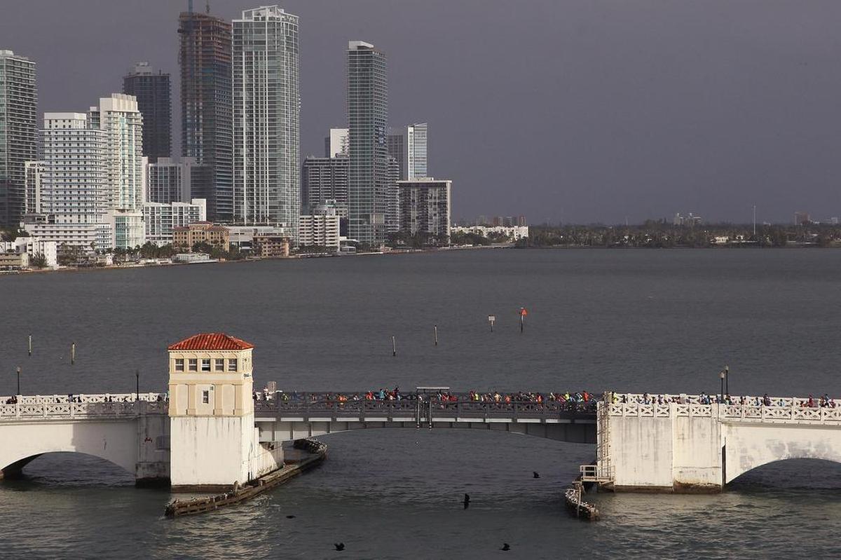Runners make their way across the Venetian Causeway during the Miami Marathon and Half Marathon on Sun., Jan. 28, 2018.
