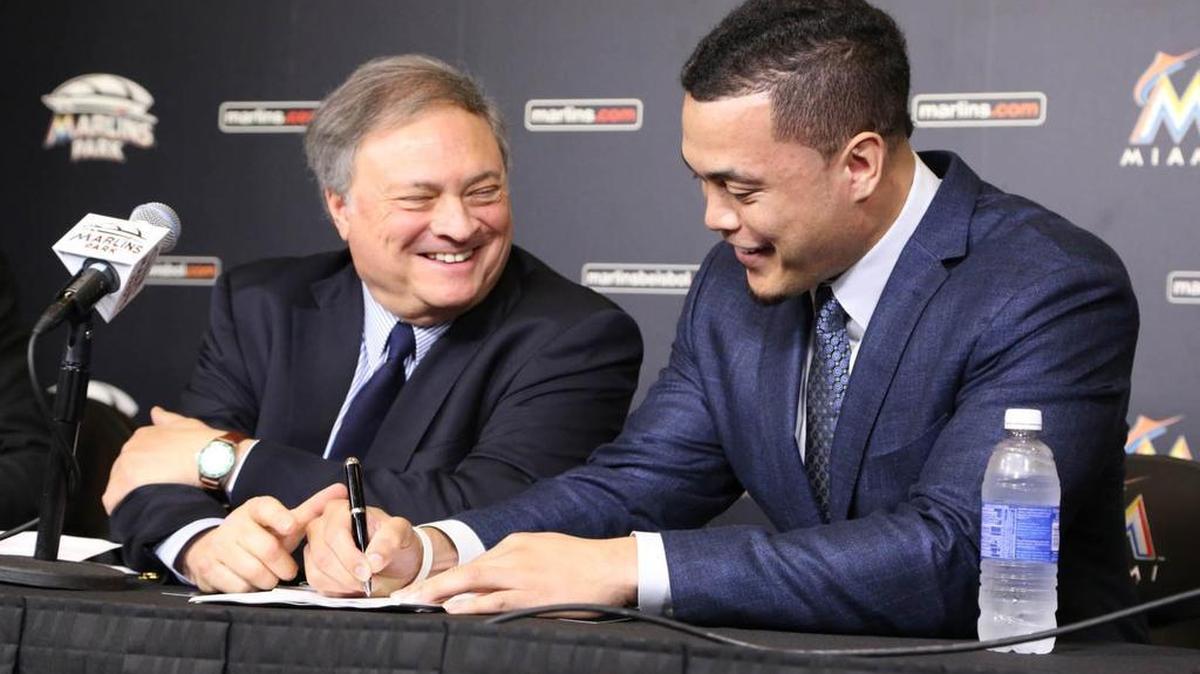 Giancarlo Stanton, with former Marlins owner Jeffrey Loria, signed a $325 million contract in 2014 that included performance bonuses for achieving a variety of goals.