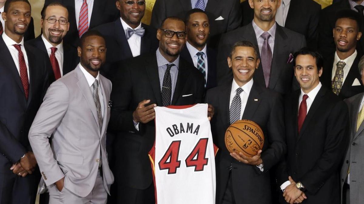 President Barack Obama stands with LeBron James (center), Dwyane Wade and coach Erik Spoelstra as he honors the 2012 NBA champion Miami Heat at the White House.