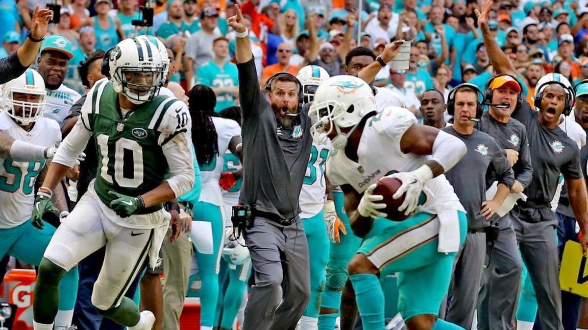 Miami Dolphins defensive coordinator Matt Burke, on the headsets, has had moments to celebrate this season but none on Sunday against New England.