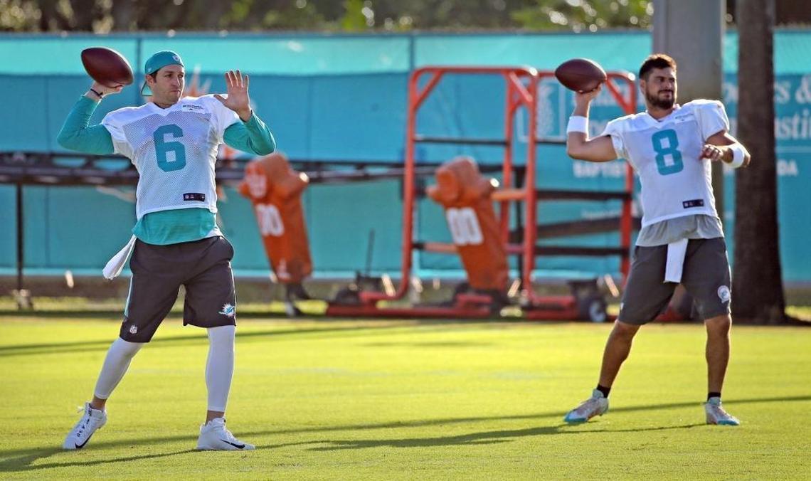 Miami Dolphins quarterbacks Jay Cutler (6) and Matt Moore (8) throw the ball during the Miami Dolphins training camp in Davie, Fl, Aug. 8, 2017.