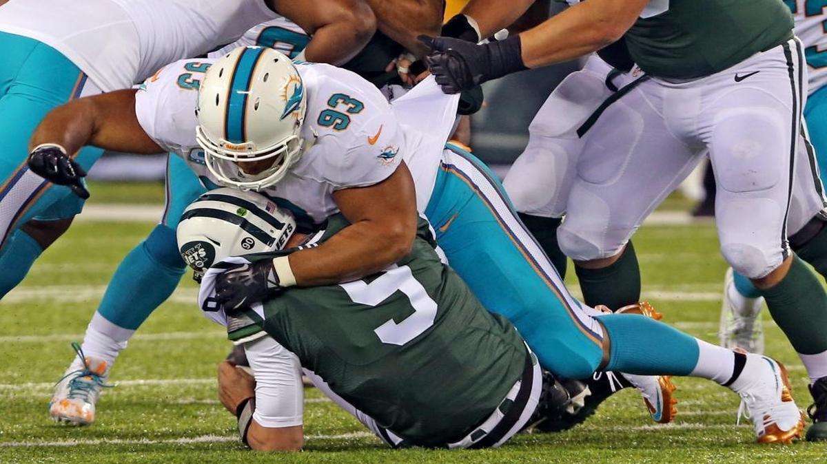 Miami Dolphins Ndamukong Suh crushes New York Jets quarterback Bryce Petty in the first quarter at MetLife Stadium in East Rutherford.