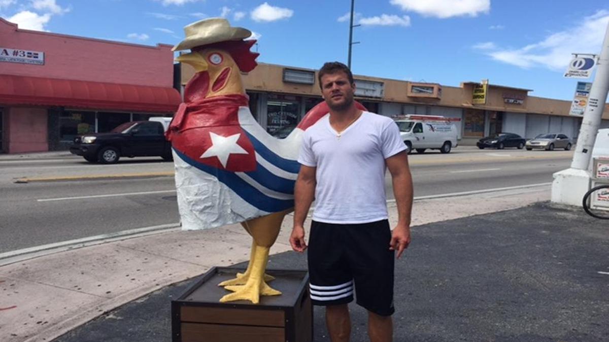 Dolphins linebacker Kiko Alonso, whose heritage is Cuban and Colombian, poses in front of La Carreta restaurant before enjoying a traditional Cuban meal for lunch.