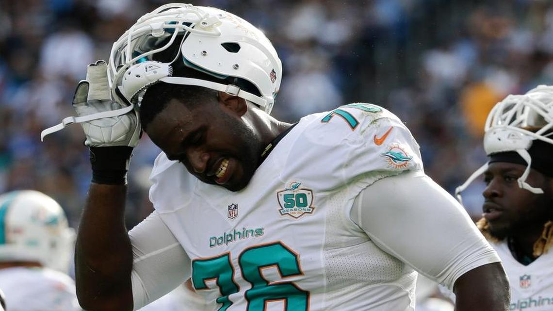 Miami Dolphins offensive tackle Branden Albert walks off the field after getting hurt on Dec. 20, 2015.