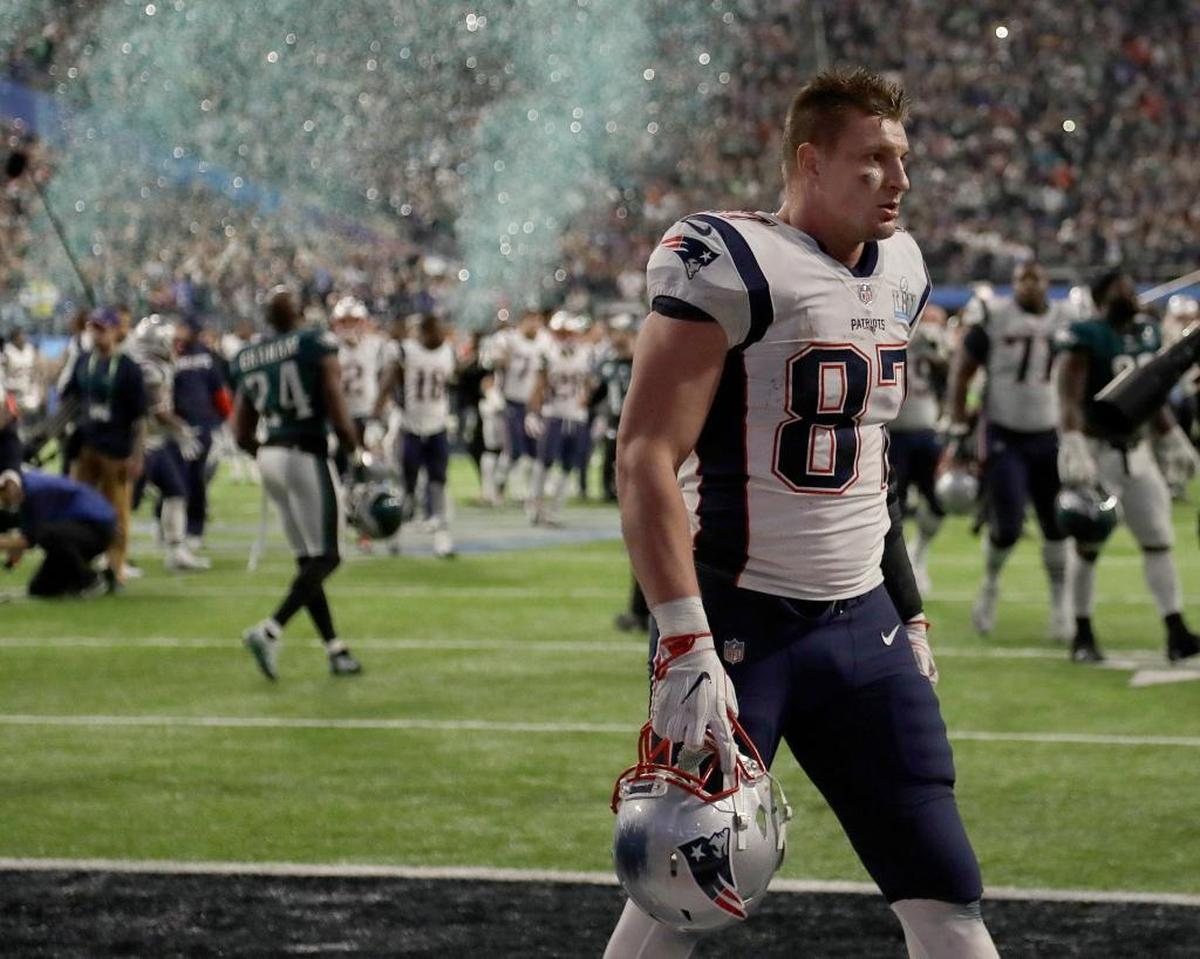 New England Patriots' Rob Gronkowski walks off the field after the NFL Super Bowl 52 football game against the Philadelphia Eagles Sunday, Feb. 4, 2018, in Minneapolis. The Eagles won 41-33.