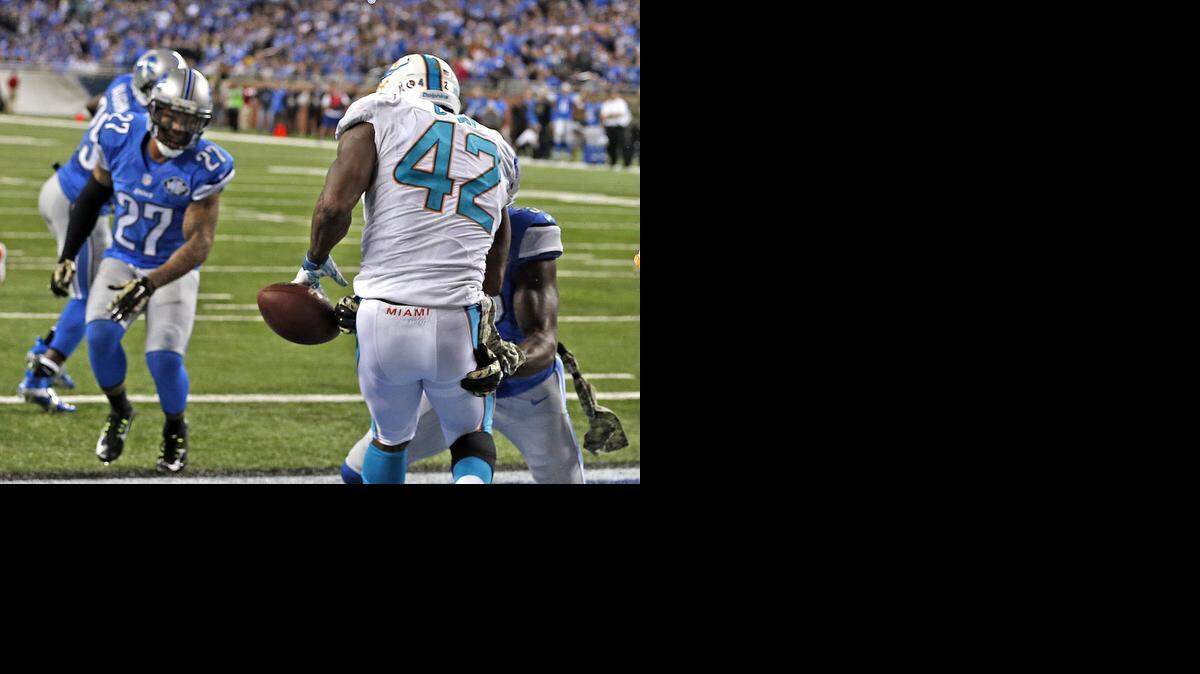 
Miami Dolphins Charles Clay drops a ball in the end zone in the fourth quarter as they play the Detroit Lions at Ford Field in Detroit on Nov. 9, 2014.
