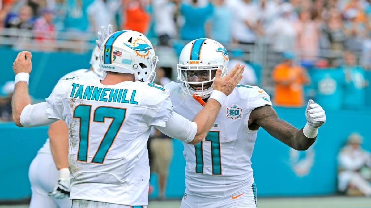 Miami Dolphins wide receiver DeVante Parker (11) and Miami Dolphins quarterback Ryan Tannehill (17) after score in the second quarter as the Miami Dolphins host the Baltimore Ravens at Sun Life Stadium on Sunday, December 6, 2015.