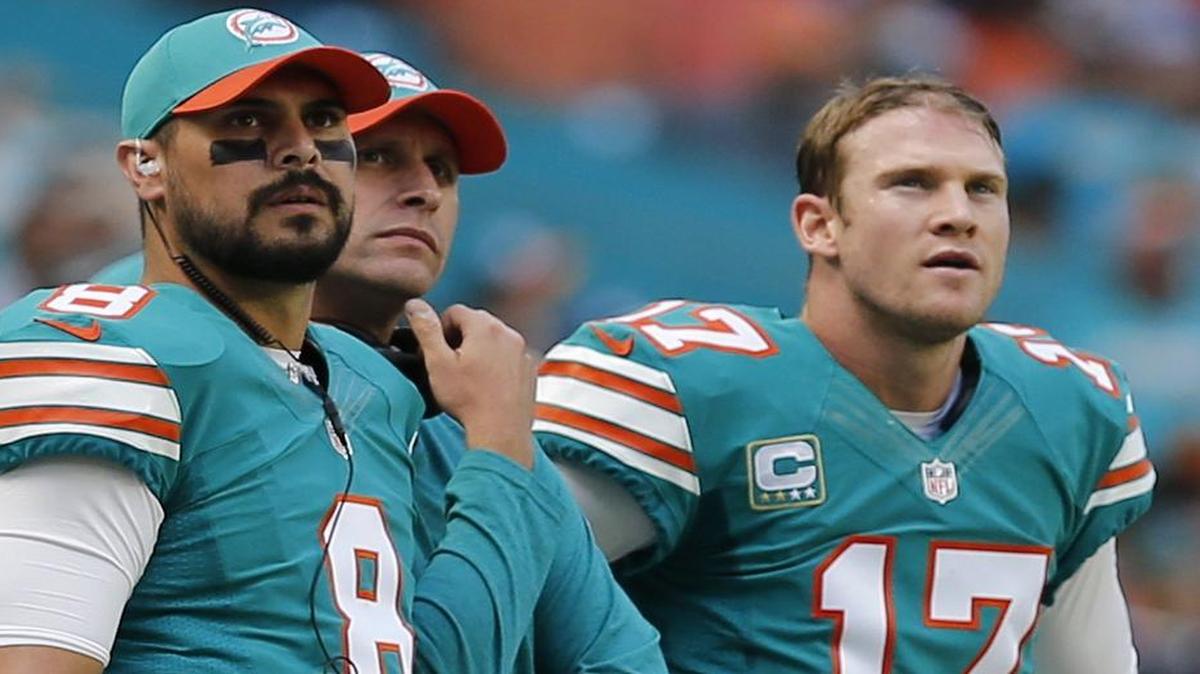 Miami Dolphins quaterbacks Matt Moore (8) and Ryan Tannehill (17), with coach Adam Gase as they play the Buffalo Bills at Hard Rock Stadium in Miami Gardens, Florida, October 23, 2016. The Dolphins like the dynamic of the two quarterbacks but insist there is only one unchallenged starter among them.
