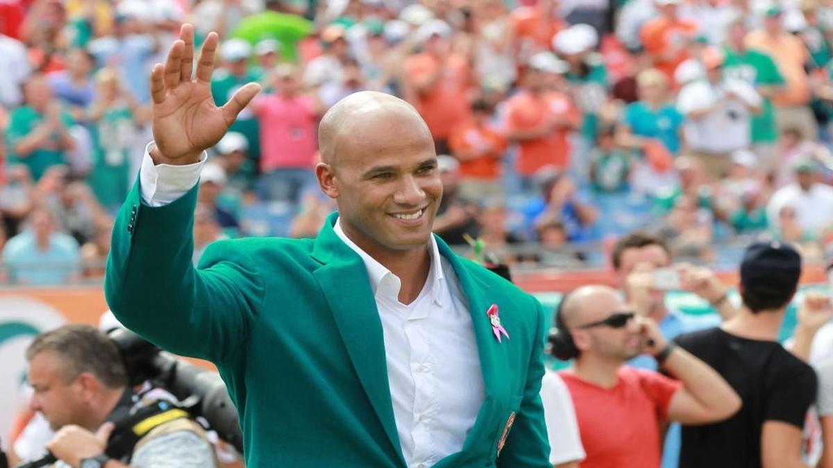 Jason Taylor waves to the crowd as his name was added to the Miami Dolphins Honor Roll at Sun Life Stadium in Miami Gardens on Sunday, October 14, 2012.