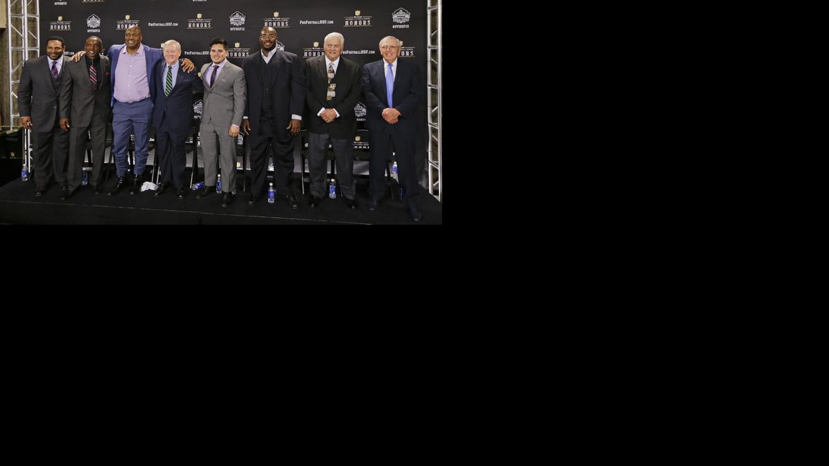 
Members of the NFL Pro Football Hall of Fame class of 2015 are introduced Saturday, Jan. 31, 2015, in Tempe, Ariz. From left are running back Jerome Bettis; wide receiver Tim Brown; defensive end and linebacker Charles Haley; Bill Polian; Tyler Seau, son of the late linebacker Junior Seau, on behalf of his father; guard Will Shields; center Mick Tingelhoff; and Ron Wolf.
