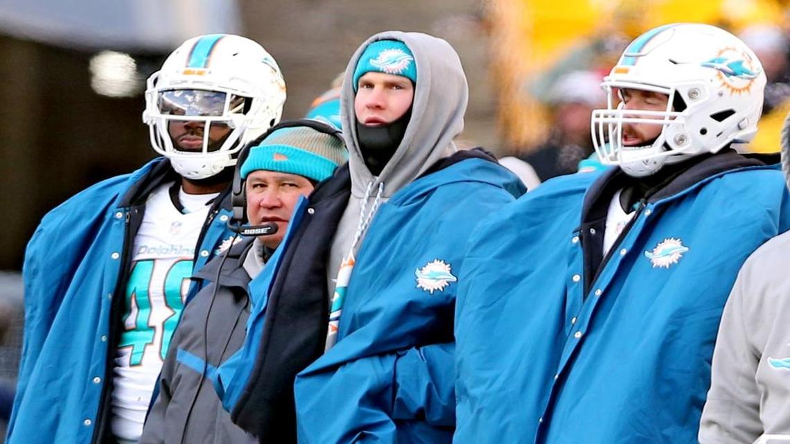 Miami Dolphins Ryan Tannehill and offensive coordinator Clyde Christensen watch from the sideline as the game slips away in the fourth quarter as they play the Pittsburgh Steelers in the NFL Wild-Card Playoffs at Heinz Stadium, Pittsburgh, PA, January 8, 2017.