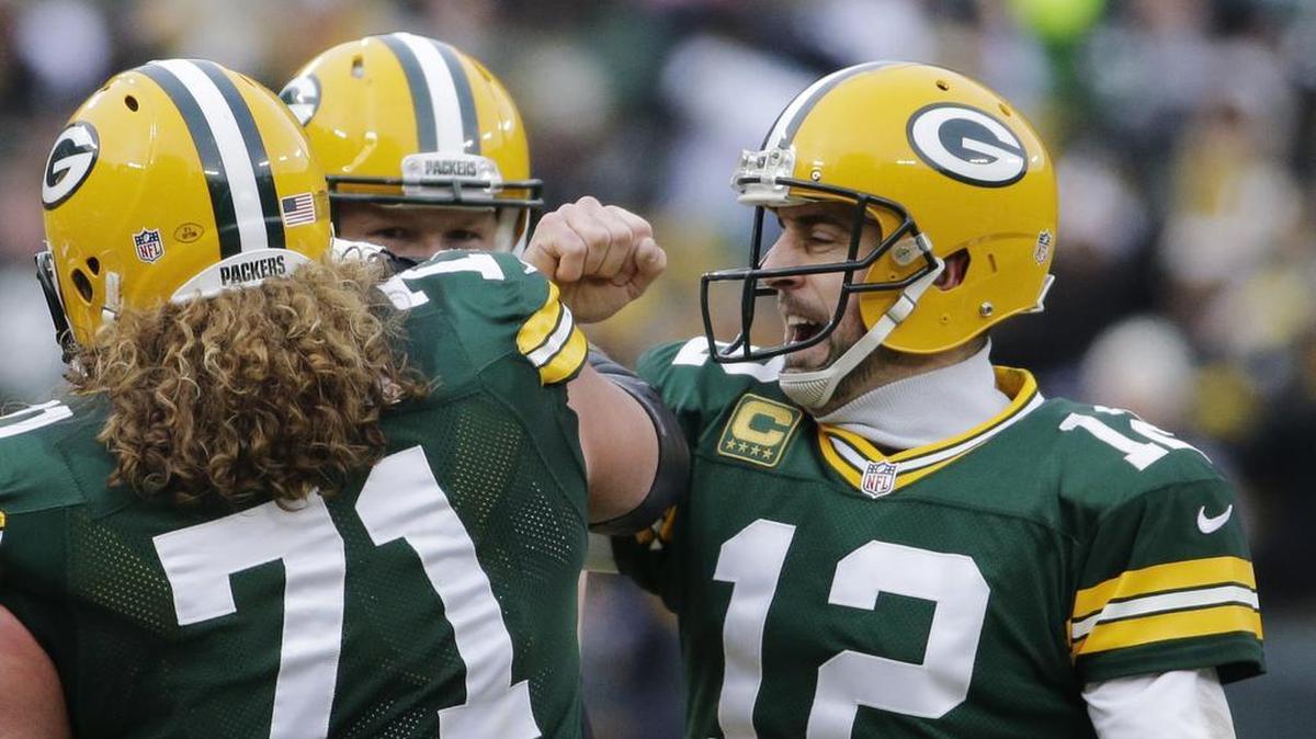 Green Bay Packers quarterback Aaron Rodgers and guard Josh Sitton celebrate a touchdown during a 2015 divisional playoff game against Dallas.